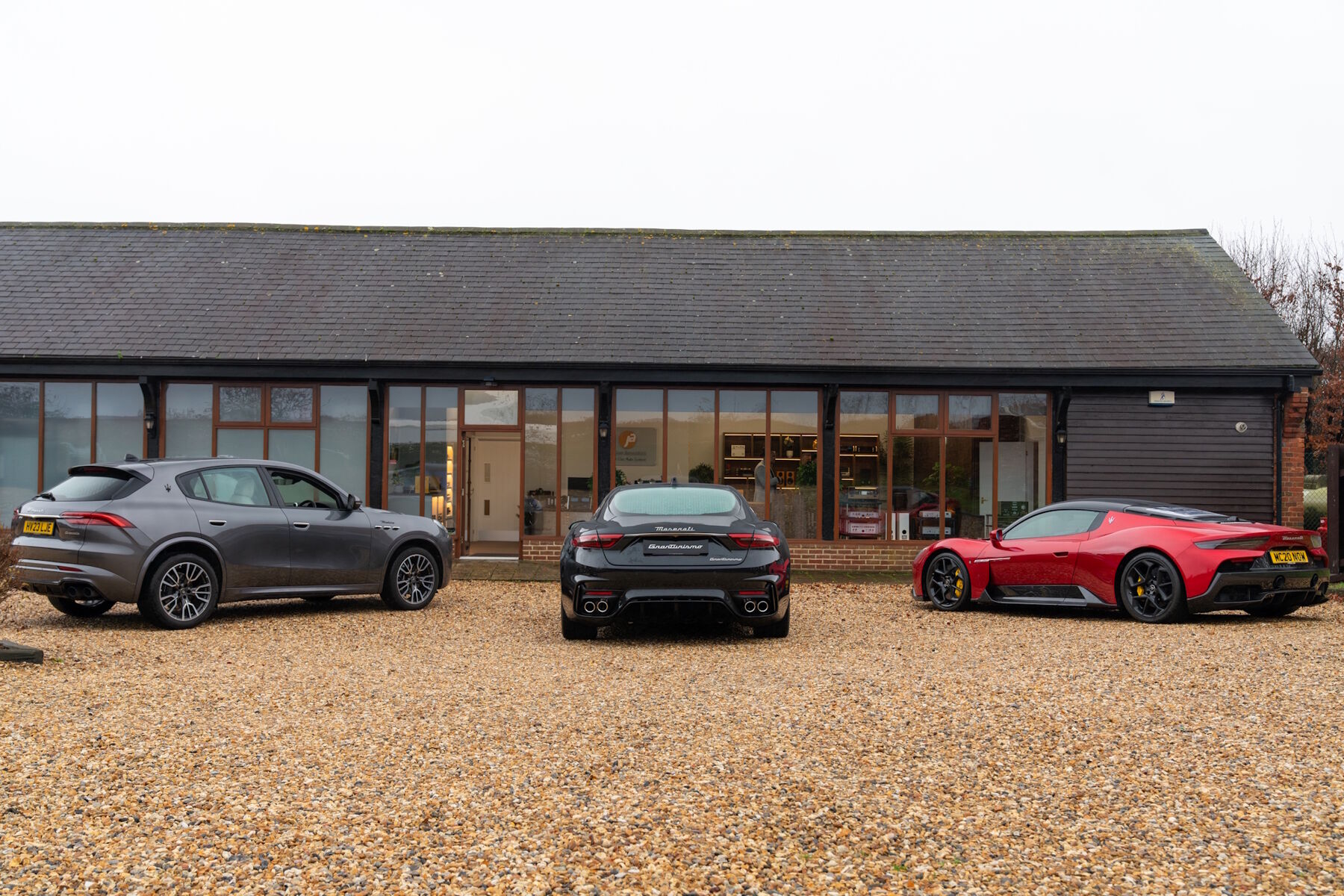 The Jordan Acoustics showroom at The Old Cart Building, Parley Court Barns, seen from the gravel forecourt